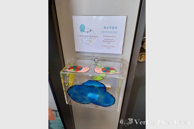 Die ursprüngliche Spendenbox, gestaltet von den Kita-Kindern.